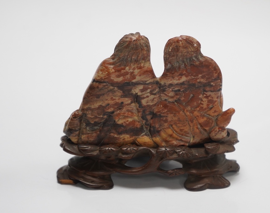 A pair of Chinese black silk embroidered ‘foot bound’ ladies shoes and a soapstone group of HeHe Erxian on carved stand, soapstone carving on stand 8cm high (3). Condition - fair to good